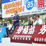 主催者代表挨拶をする影山実行委員長